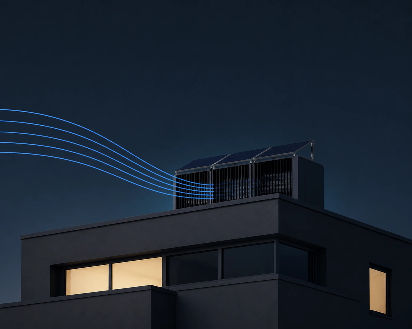 A rooftop wind unit on a modern building at dusk, catching the wind